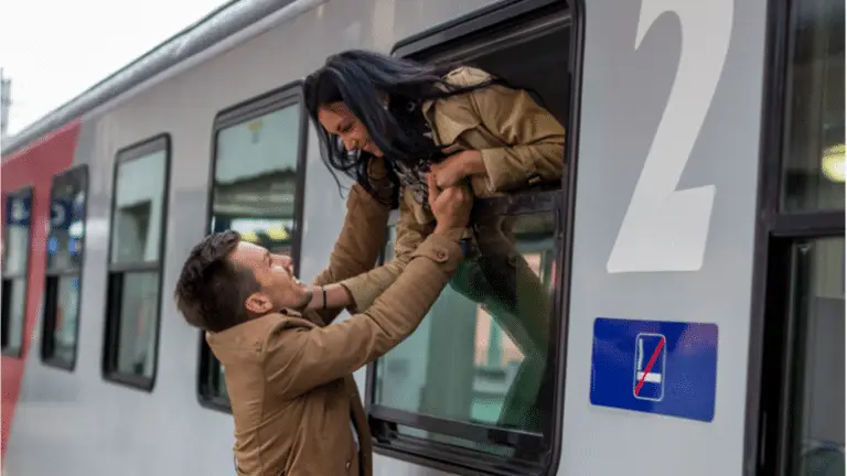 man and woman saying goodbye on train