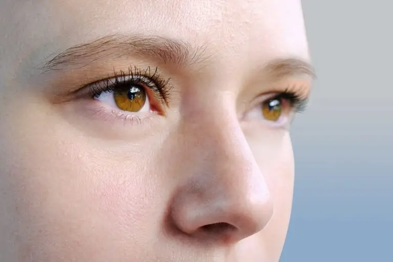 A close up image of a woman looking off into the distance, highlighting her eyes.