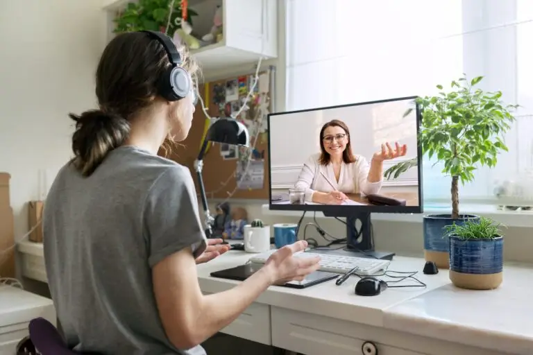 A young woman talking to her online mental health therapist on video chat